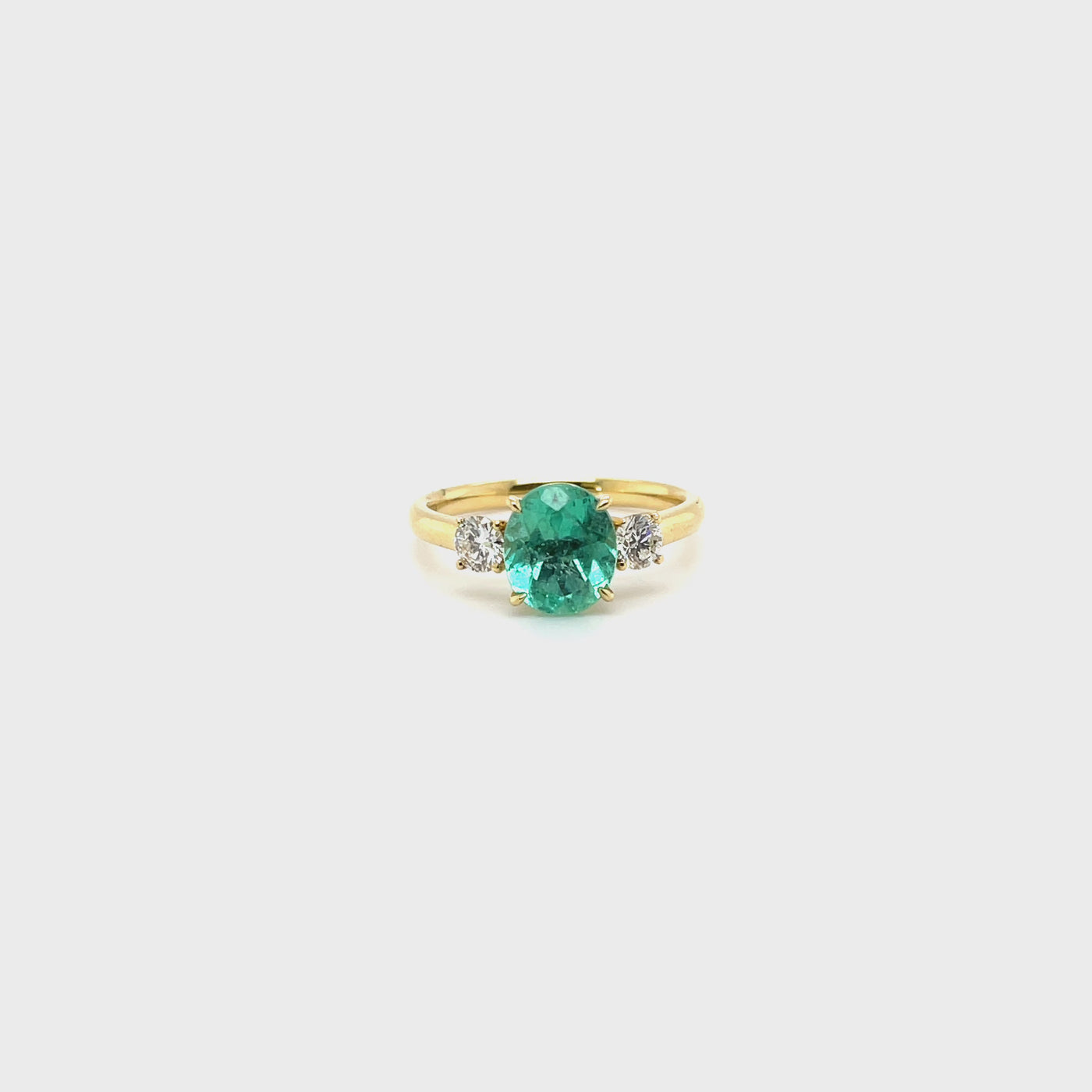 18 karat Emerald and Diamond trilogy ring