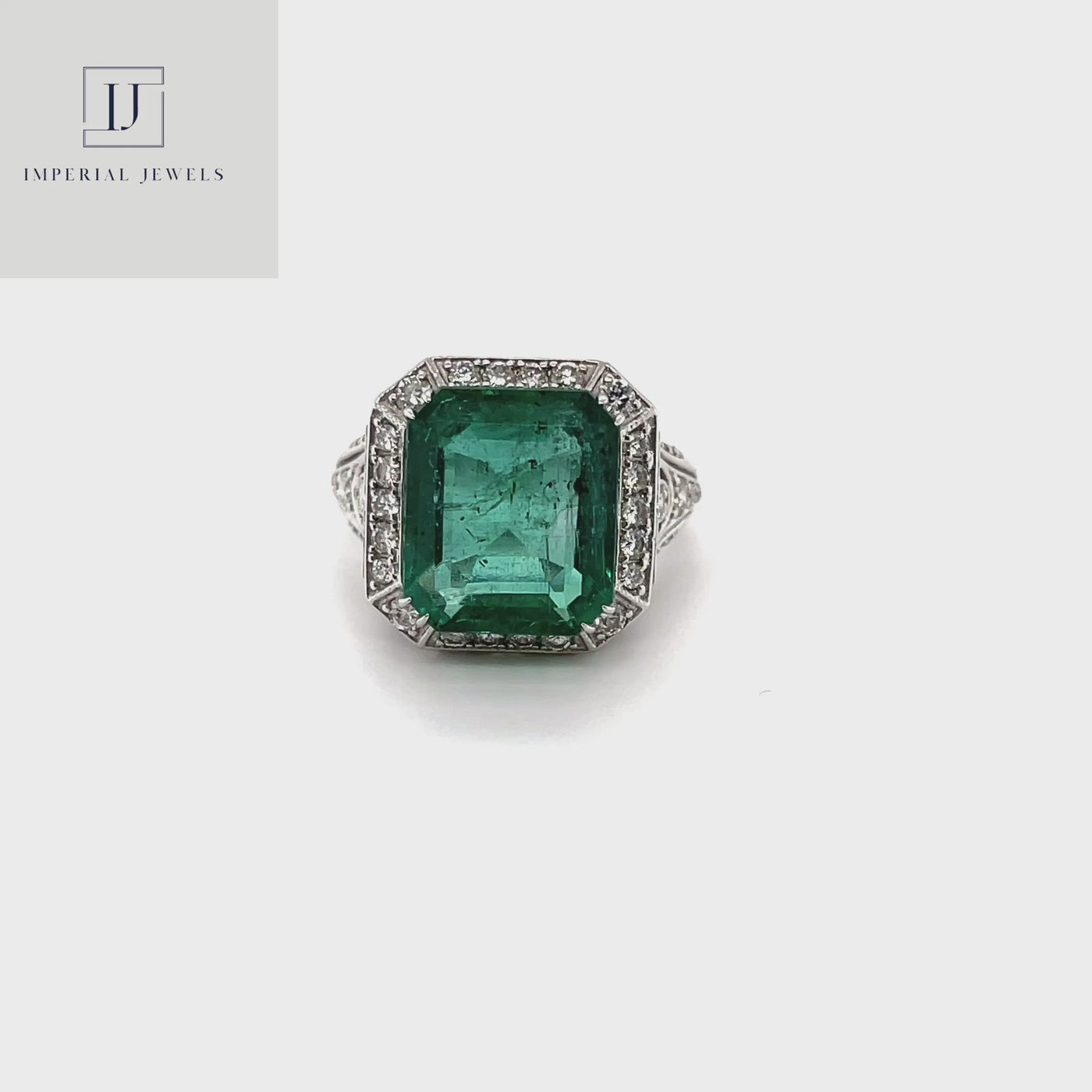 18CT White Gold Emerald and Diamond Ring