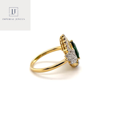 18CT yellow gold heart cut emerald and diamond ring