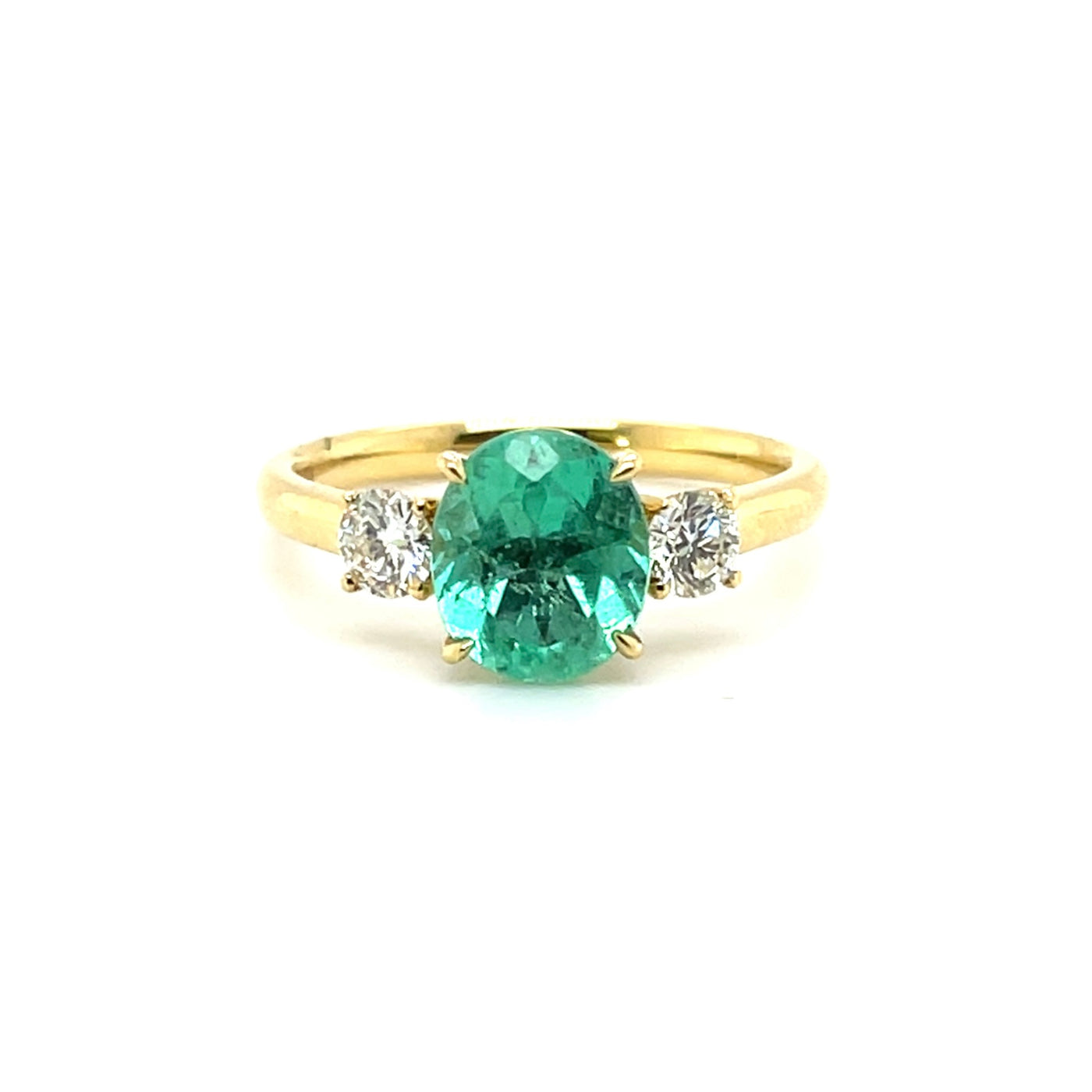 18 karat Emerald and Diamond trilogy ring